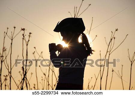 Picture - Little girl taking pictures with compact camera, Passeig de les Aigües, Collserola mountain, Barcelona, Catalonia, Spain.. Fotosearch