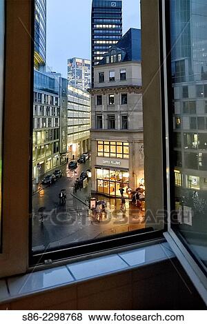 Looking at Kaiserplatz, Frankfurt, Germany, on a Rainy Night. through an open window. View Large Photo Image Stock Photo - Looking at Kaiserplatz, Frankfurt, Germany, on a Rainy Night. through an open window.. Fotosearch