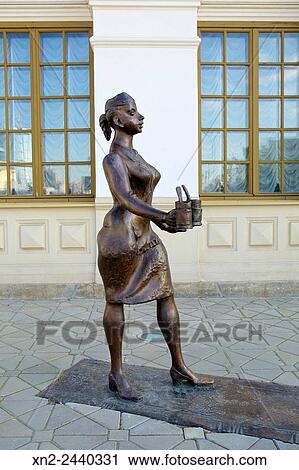Stock Image - Main Train Station - Now a Museum of Science and Industry - Bronze Sculpture of railway workers - This statue is of a Provodnitsa - (carriage attendant). Yekaterinburg. Siberia. Russia. Fotosearch
