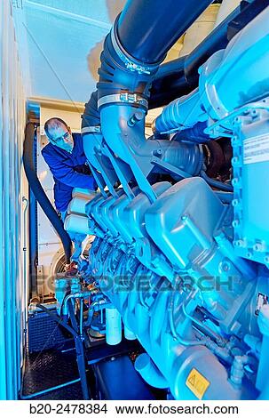 Maintenance worker, Cogeneration engine, Electric generator, uninterrupted electric service, Hospital Donostia, San Sebastian, Gipuzkoa, Basque Country, Spain View Large Photo Image Picture - Maintenance worker, Cogeneration engine, Electric generator, uninterrupted electric service, Hospital Donostia, San Sebastian, Gipuzkoa, Basque Country, Spain. Fotosearch