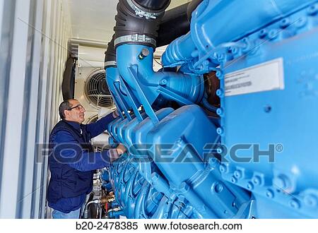 Stock Photography - Maintenance worker, Cogeneration engine, Electric generator, uninterrupted electric service, Hospital Donostia, San Sebastian, Gipuzkoa, Basque Country, Spain. Fotosearch
