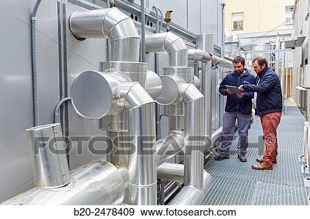 Maintenance worker, Installation of air conditioning, Ventilation air filters of the operating rooms, Hospital Donostia, San Sebastian, Gipuzkoa, Basque Country, Spain View Large Photo Image Stock Photo - Maintenance worker, Installation of air conditioning, Ventilation air filters of the operating rooms, Hospital Donostia, San Sebastian, Gipuzkoa, Basque Country, Spain. Fotosearch