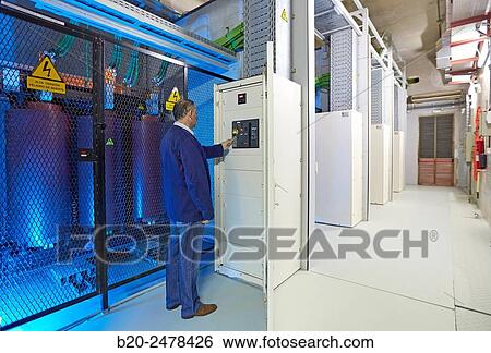 Stock Photograph - Maintenance worker, Trafo, Electrical transformers, Wiring, Hospital Donostia, San Sebastian, Gipuzkoa, Basque Country, Spain. Fotosearch