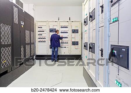 Maintenance worker, UPS, batteries for uninterrupted electricity, Wiring, electrical panels, Hospital Donostia, San Sebastian, Gipuzkoa, Basque Country, Spain View Large Photo Image Picture - Maintenance worker, UPS, batteries for uninterrupted electricity, Wiring, electrical panels, Hospital Donostia, San Sebastian, Gipuzkoa, Basque Country, Spain. Fotosearch
