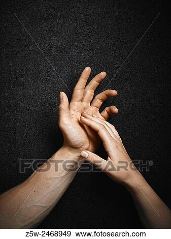 Man and woman, hands connecting together, dark canvas background. View Large Photo Image Stock Photo - Man and woman, hands connecting together, dark canvas background.. Fotosearch