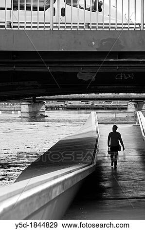 man walking under Mt Blanc bridge on Rhone river, car on the bridge, Geneva, Switzerland View Large Photo Image Stock Photo - man walking under Mt Blanc bridge on Rhone river, car on the bridge, Geneva, Switzerland. Fotosearch