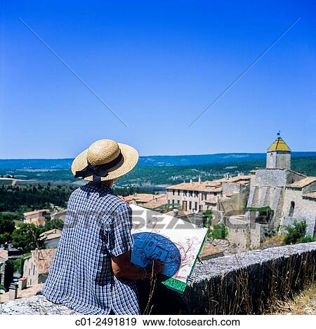 Middle aged woman drawing Aurel perched village, Vaucluse, Provence, France. View Large Photo Image Stock Photo - Middle aged woman drawing Aurel perched village, Vaucluse, Provence, France.. Fotosearch