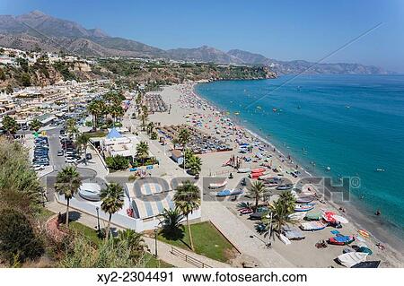 Stock Image - Nerja, Costa del Sol, Malaga Province, Andalusia, southern Spain. Burriana beach seen from gardens of the Parador Nacional.. Fotosearch