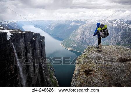 Norway, Rogaland, Lysefjord, Kjerag (Kiragg), hiker watching the fjord 1000m below, Model Released. View Large Photo Image Stock Image - Norway, Rogaland, Lysefjord, Kjerag (Kiragg), hiker watching the fjord 1000m below, Model Released.. Fotosearch