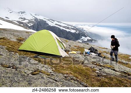 Stock Photo - Norway, Rogaland, Lysefjord, Kjerag (Kiragg), wild camping in Kjeragbolten area, Model Released.. Fotosearch