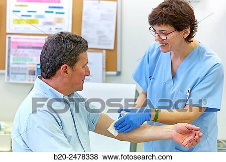 Nurse performing cure, Nursing room, Medical consultation, Ambulatory Lezo, Gipuzkoa, Basque Country, Spain View Large Photo Image Stock Photo - Nurse performing cure, Nursing room, Medical consultation, Ambulatory Lezo, Gipuzkoa, Basque Country, Spain. Fotosearch
