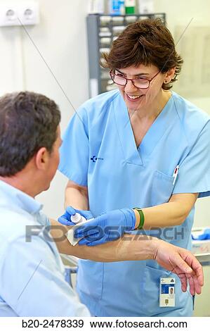 Nurse performing cure, Nursing room, Medical consultation, Ambulatory Lezo, Gipuzkoa, Basque Country, Spain View Large Photo Image Stock Photo - Nurse performing cure, Nursing room, Medical consultation, Ambulatory Lezo, Gipuzkoa, Basque Country, Spain. Fotosearch