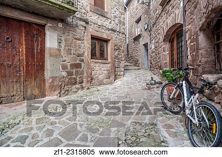 Old village street in L´Estany, Catalonia, Spain. View Large Photo Image Stock Photography - Old village street in L´Estany, Catalonia, Spain.. Fotosearch