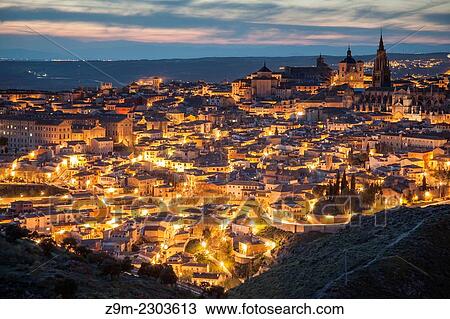 Stock Image - Panorama of Toledo old town at nightfall, Castilla-La Mancha, Spain.. Fotosearch