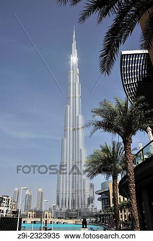 Peak of the Burj Khalifa gleaming in the sun reflection, Burj Park, Dubai, United Arab Emirates. View Large Photo Image Stock Photography - Peak of the Burj Khalifa gleaming in the sun reflection, Burj Park, Dubai, United Arab Emirates.. Fotosearch