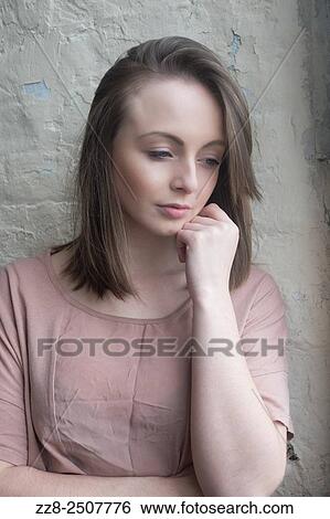 Pensive young woman looking away. View Large Photo Image Stock Photograph - Pensive young woman looking away.. Fotosearch