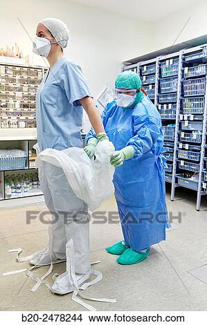 Personal protective equipment, protection for the care of patients with infectious diseases (Ebola), Drugs store, Nursing station, Hospital Donostia, San Sebastian, Gipuzkoa, Basque Country, Spain View Large Photo Image Picture - Personal protective equipment, protection for the care of patients with infectious diseases (Ebola), Drugs store, Nursing station, Hospital Donostia, San Sebastian, Gipuzkoa, Basque Country, Spain. Fotosearch