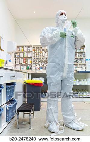 Stock Image - Personal protective equipment, protection for the care of patients with infectious diseases (Ebola), Drugs store, Nursing station, Hospital Donostia, San Sebastian, Gipuzkoa, Basque Country, Spain. Fotosearch