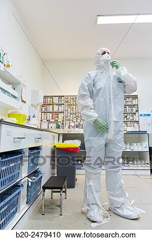 Stock Image - Personal protective equipment, protection for the care of patients with infectious diseases (Ebola), Drugs store, Nursing station, Hospital Donostia, San Sebastian, Gipuzkoa, Basque Country, Spain. Fotosearch