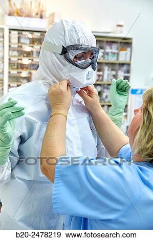 Personal protective equipment, protection for the care of patients with infectious diseases (Ebola), Drugs store, Nursing station, Hospital Donostia, San Sebastian, Gipuzkoa, Basque Country, Spain View Large Photo Image Stock Photo - Personal protective equipment, protection for the care of patients with infectious diseases (Ebola), Drugs store, Nursing station, Hospital Donostia, San Sebastian, Gipuzkoa, Basque Country, Spain. Fotosearch