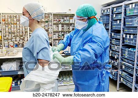 Personal protective equipment, protection for the care of patients with infectious diseases (Ebola), Drugs store, Nursing station, Hospital Donostia, San Sebastian, Gipuzkoa, Basque Country, Spain View Large Photo Image Stock Photo - Personal protective equipment, protection for the care of patients with infectious diseases (Ebola), Drugs store, Nursing station, Hospital Donostia, San Sebastian, Gipuzkoa, Basque Country, Spain. Fotosearch