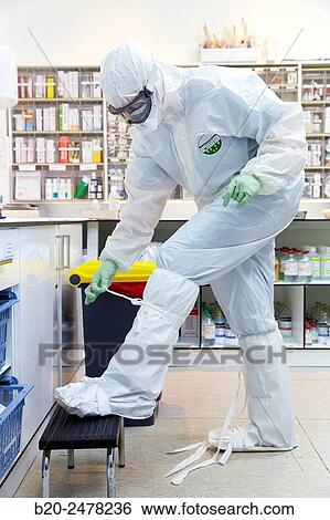 Stock Photograph - Personal protective equipment, protection for the care of patients with infectious diseases (Ebola), Drugs store, Nursing station, Hospital Donostia, San Sebastian, Gipuzkoa, Basque Country, Spain. Fotosearch