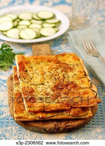 Stock Image - Pizza with courgettes.. Fotosearch
