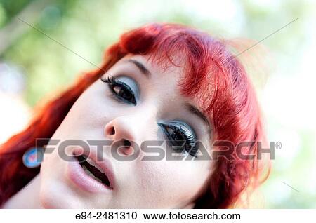 Portrait of a 23 year old red head woman looking at the camera with mouth open, outdoors. View Large Photo Image Stock Image - Portrait of a 23 year old red head woman looking at the camera with mouth open, outdoors.. Fotosearch