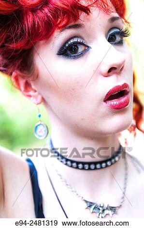 Portrait of a 23 year old red head woman looking at the camera with mouth open, outdoors. View Large Photo Image Stock Photo - Portrait of a 23 year old red head woman looking at the camera with mouth open, outdoors.. Fotosearch