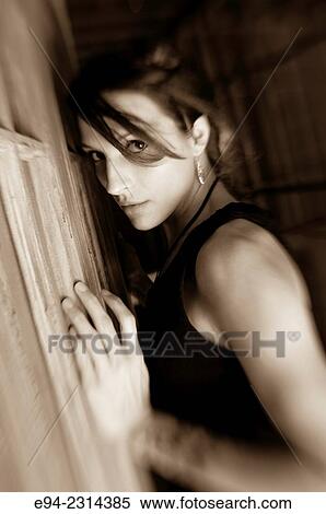 Portrait of a 30 year old brunette with hair partially covering her face, black & white. View Large Photo Image Stock Photography - Portrait of a 30 year old brunette with hair partially covering her face, black & white.. Fotosearch