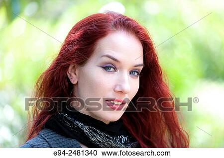 Portrait of a 37 year old redheaded woman looking at the camera, outdoors. View Large Photo Image Stock Image - Portrait of a 37 year old redheaded woman looking at the camera, outdoors.. Fotosearch