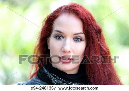 Portrait of a 37 year old redheaded woman looking at the camera, outdoors. View Large Photo Image Stock Photo - Portrait of a 37 year old redheaded woman looking at the camera, outdoors.. Fotosearch