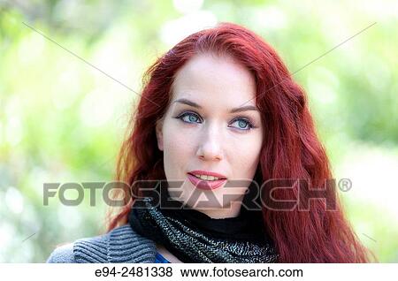 Portrait of a 37 year old redheaded woman looking way from the camera, outdoors. View Large Photo Image Stock Photo - Portrait of a 37 year old redheaded woman looking way from the camera, outdoors.. Fotosearch