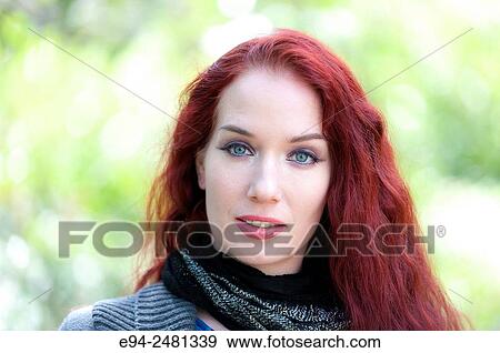 Portrait of a 37 year old redheaded woman looking at the camera, outdoors. View Large Photo Image Stock Photo - Portrait of a 37 year old redheaded woman looking at the camera, outdoors.. Fotosearch