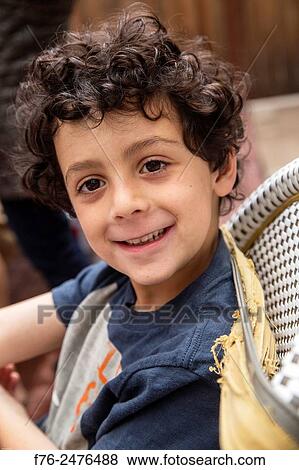 Portrait of a smiling 7 year old boy, mr# 6302. View Large Photo Image Stock Photo - Portrait of a smiling 7 year old boy, mr# 6302.. Fotosearch