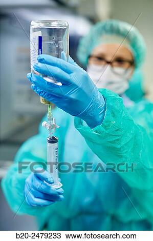 Stock Image - Preparation of drugs in laminar flow hood, epidural anesthesia, Clean room, Pharmacy, Hospital Donostia, San Sebastian, Gipuzkoa, Basque Country, Spain. Fotosearch