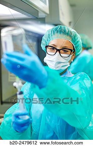 Stock Image - Preparation of drugs in laminar flow hood, epidural anesthesia, Clean room, Pharmacy, Hospital Donostia, San Sebastian, Gipuzkoa, Basque Country, Spain. Fotosearch