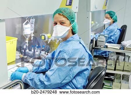 Stock Photo - Preparation of drugs in laminar flow hood, epidural anesthesia, Clean room, Pharmacy, Hospital Donostia, San Sebastian, Gipuzkoa, Basque Country, Spain. Fotosearch