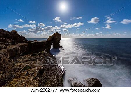 Pulpit Rock on the Isle of Portland at moonlight, Dorset, England, United Kingdom, Europe. View Large Photo Image Stock Photo - Pulpit Rock on the Isle of Portland at moonlight, Dorset, England, United Kingdom, Europe.. Fotosearch