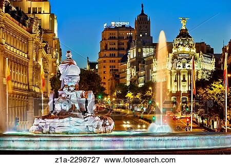 Stock Photo - Rear view of Cibeles fountain with the Metropolis building at the background. Madrid, Spain.. Fotosearch