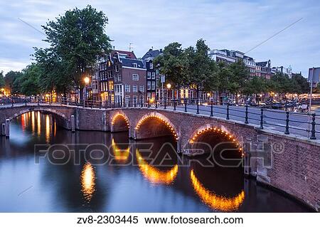 Reguliersgracht Canal at night. The historic centre of Amsterdam and its canals have been designqted a World Heritage Site by UNESCO. View Large Photo Image Stock Photography - Reguliersgracht Canal at night. The historic centre of Amsterdam and its canals have been designqted a World Heritage Site by UNESCO.. Fotosearch