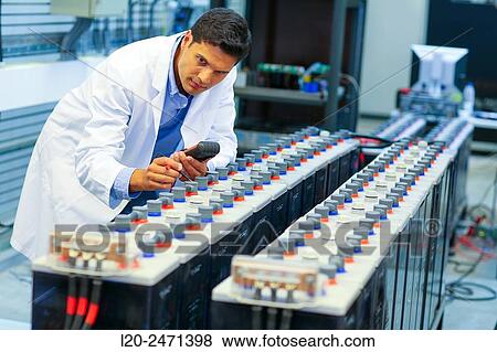 Stock Photo - Researcher. Classic Solar Batteries. Solar Liquid Cell. Technological research on energy. Energy and Environment. Tecnalia Research & innovation, Bizkaia, Basque Country, Spain.. Fotosearch