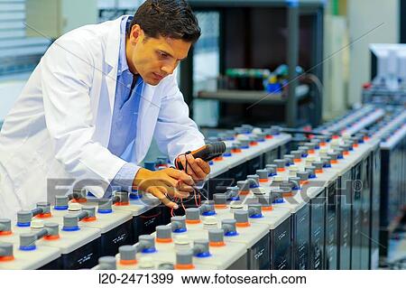 Stock Photo - Researcher. Classic Solar Batteries. Solar Liquid Cell. Technological research on energy. Energy and Environment. Tecnalia Research & innovation, Bizkaia, Basque Country, Spain.. Fotosearch