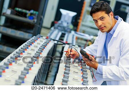 Stock Photograph - Researcher. Classic Solar Batteries. Solar Liquid Cell. Technological research on energy. Energy and Environment. Tecnalia Research & innovation, Bizkaia, Basque Country, Spain.. Fotosearch