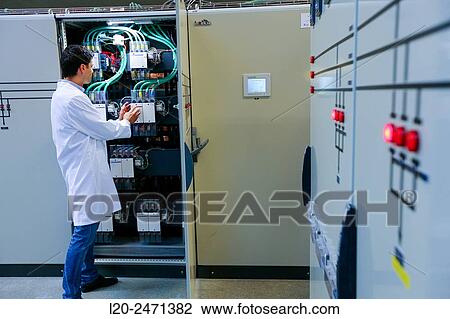 Stock Image - Researcher. Low Voltage Micro Network. Testing and Certificates Services for Smart Grids and Smart meters. Certification of Power Electronics Equipment. Technological Services to Industry. Tecnalia Research & innovation, Bizkaia, Basque Country, Spain.. Fotosearch
