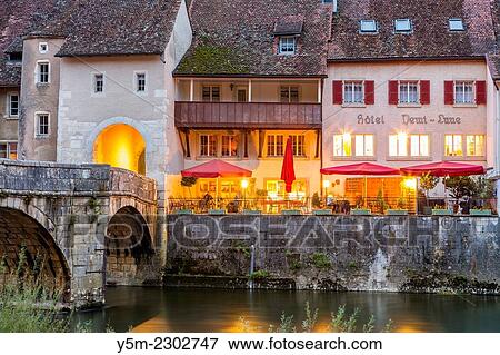 Restaurant on the banks of the river Doubs, Saint-Ursanne, Canton du Jura, Switzerland, Europe. View Large Photo Image Stock Photo - Restaurant on the banks of the river Doubs, Saint-Ursanne, Canton du Jura, Switzerland, Europe.. Fotosearch