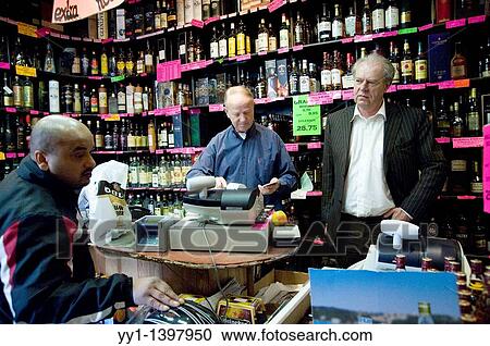 Rotterdam, Netherlands. Two senior adults selling beer from their specialized beer store. View Large Photo Image Stock Image - Rotterdam, Netherlands. Two senior adults selling beer from their specialized beer store.. Fotosearch