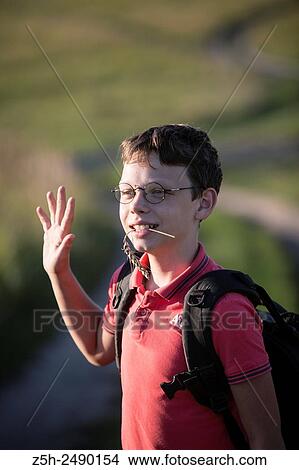 Picture - Russia. Belgorod region. Solomino village. The boy goes to the village school.. Fotosearch