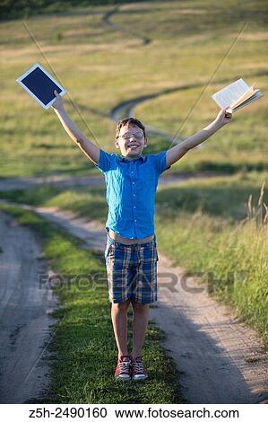Stock Image - Russia. Belgorod region. Solomino village. The boy goes to the village school.. Fotosearch