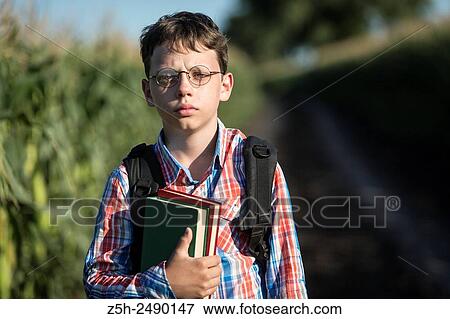 Russia. Belgorod region. Solomino village. The boy goes to the village school. View Large Photo Image Stock Photo - Russia. Belgorod region. Solomino village. The boy goes to the village school.. Fotosearch